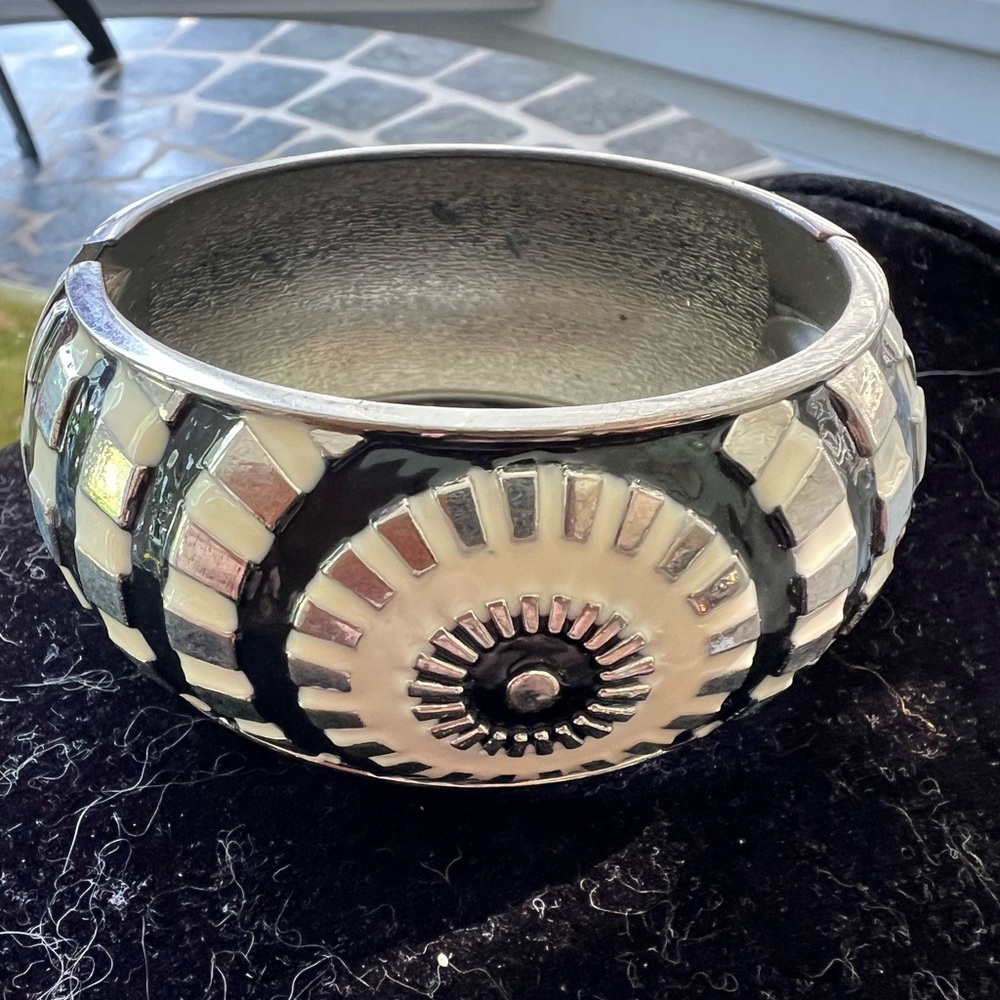 Enamel black, white and silver hinged bangle with geometric design. 2.5”diameter